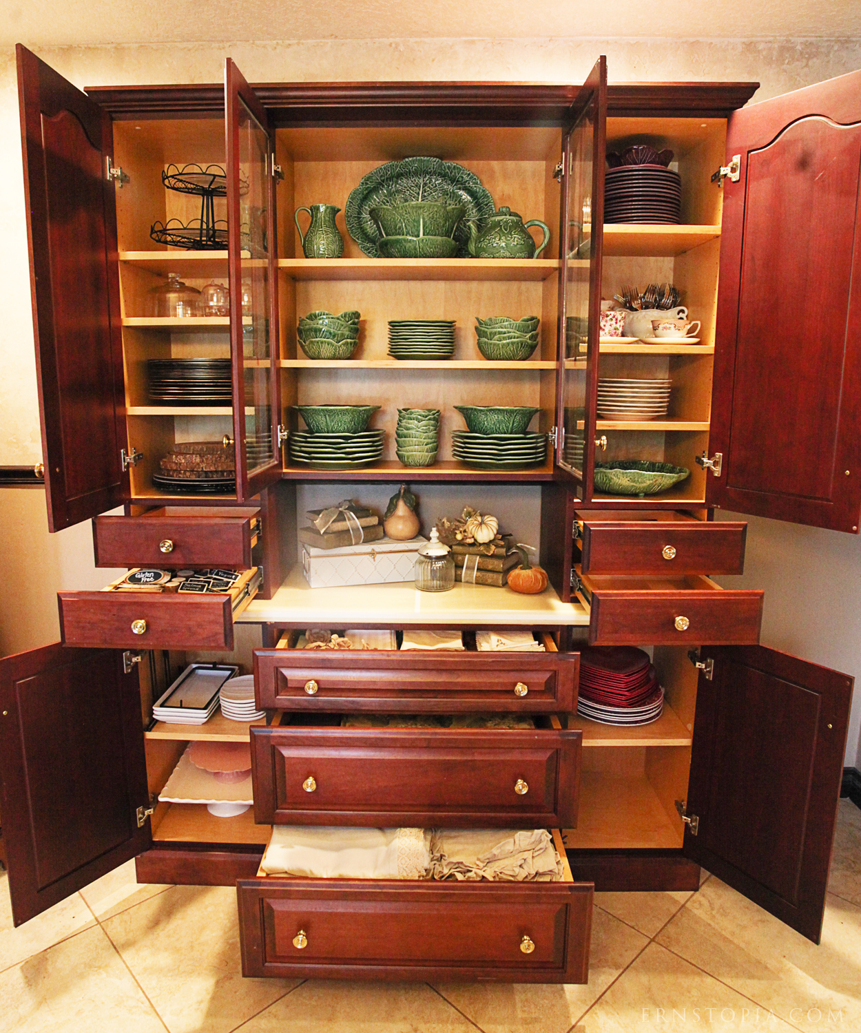 A look at the dishes and linens inside of my dining room hutch