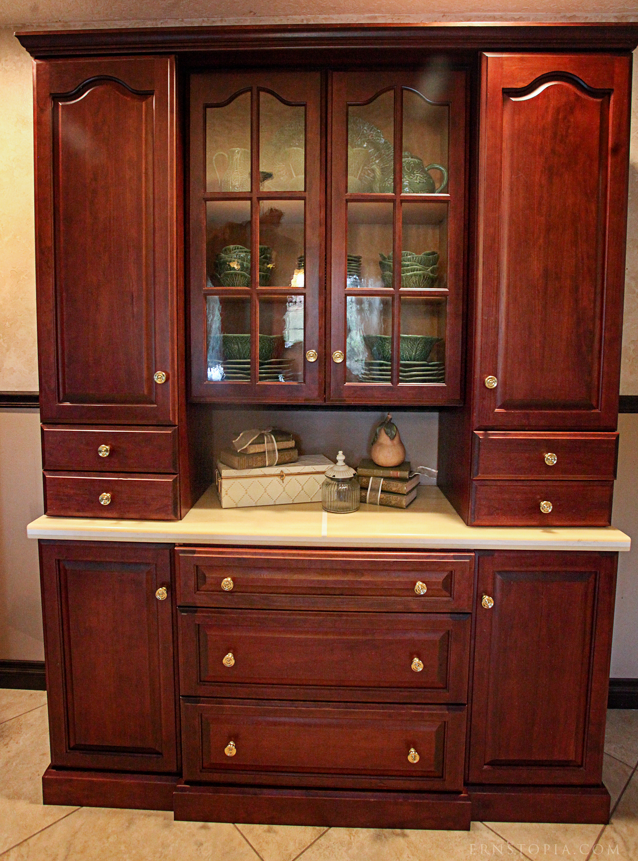My dining room hutch features glass doors and cupboards that extend to the counter as well as drawers and lower cabinets that store my linens and larger serving pieces.