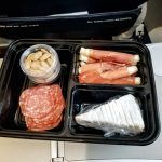 Using meal prep containers to prepare keto snacks for traveling