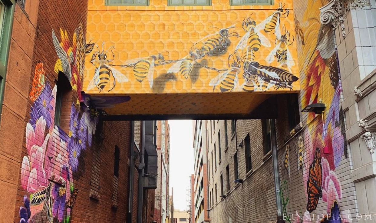 Beautiful Denver mural featuring butterflies, bees and hummingbirds