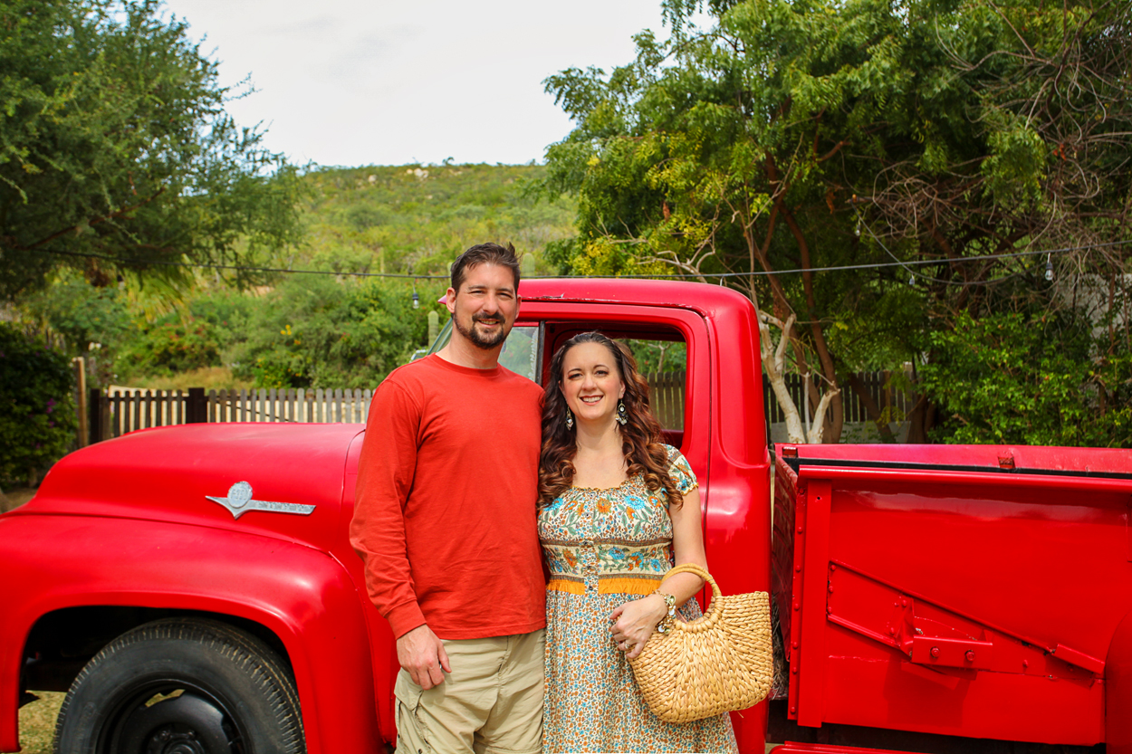 Standing in front of the red truck at Flora Farms