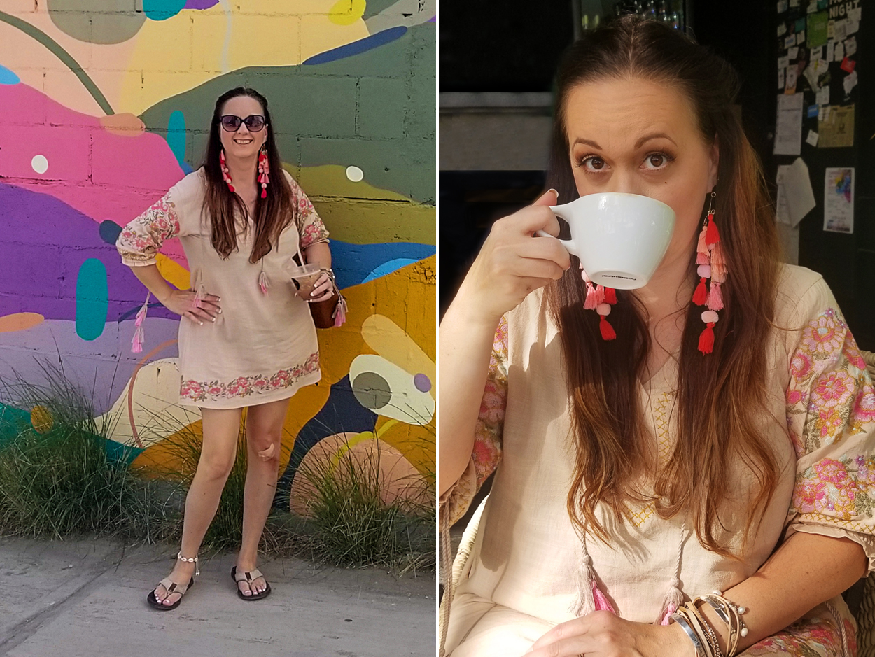 Wearing a pink embroidered dress in front of a desert mural in San Jose del Cabo. 