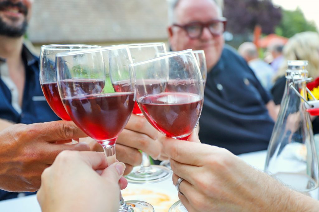 A toast with new friends at the Farm to Table Dinner at Blakeslee Vineyard